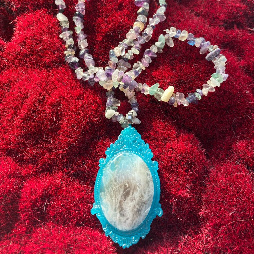Handmade Creamy Moss Agate Cab in poured resin setting on fluorite chips strand